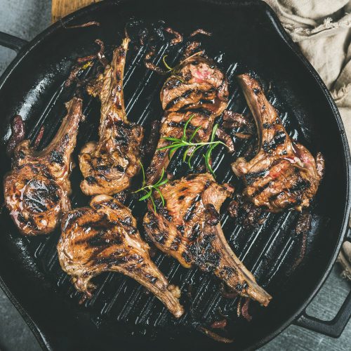 Barbecue dinner with grilled lamb meat chops in pan